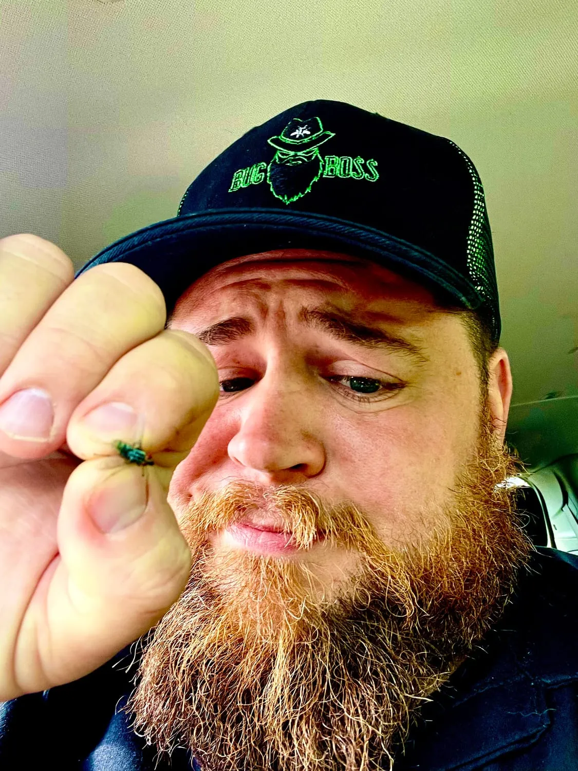 Brian Zahringer inspecting a small insect up close