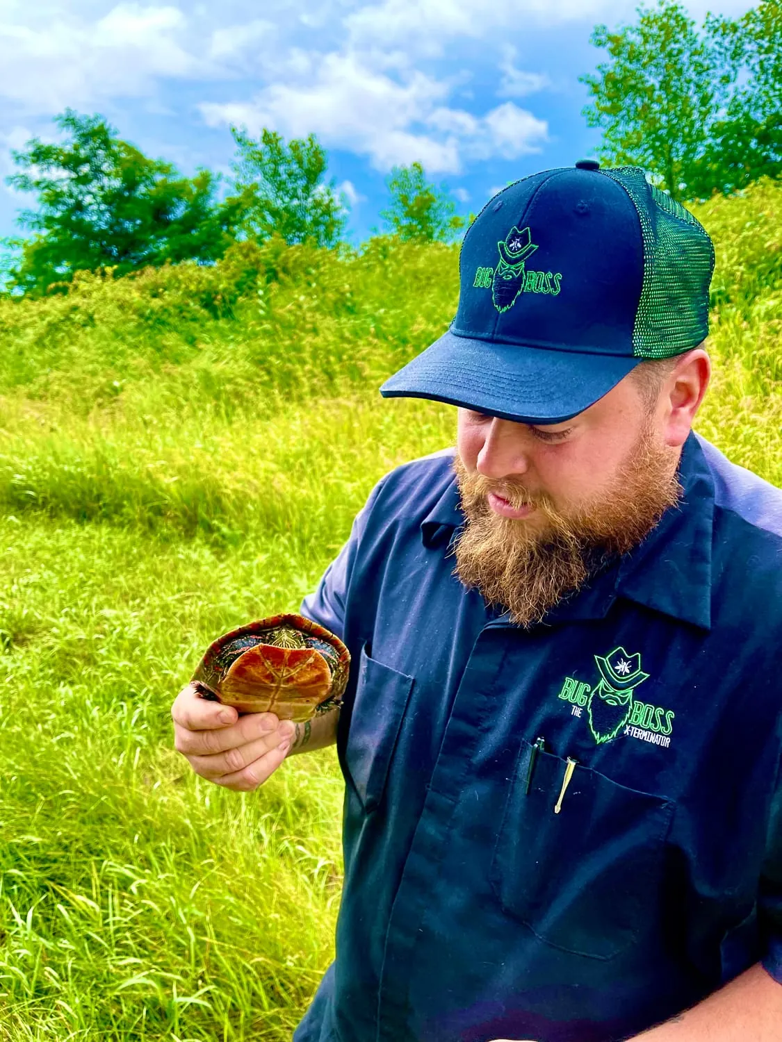 Brian showing a captured pest during a BugBoss service call